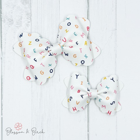 Scattered Alphabet Scalloped Phoebe Bow